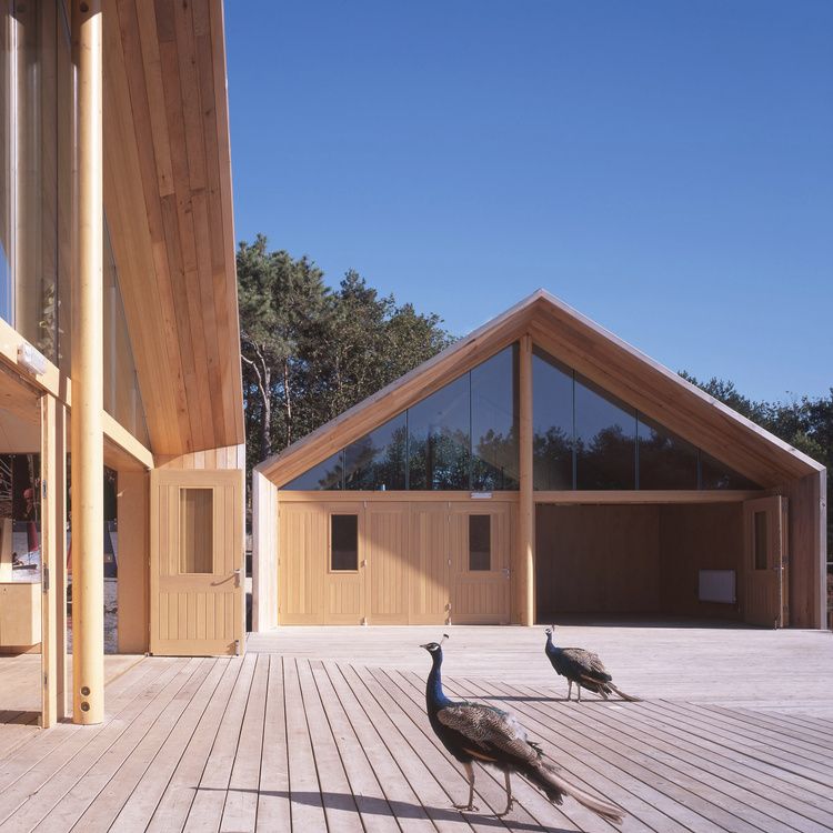 Baden-Powell Outdoor Centre, a timber-clad building with a glazed gabled end opening onto a deck