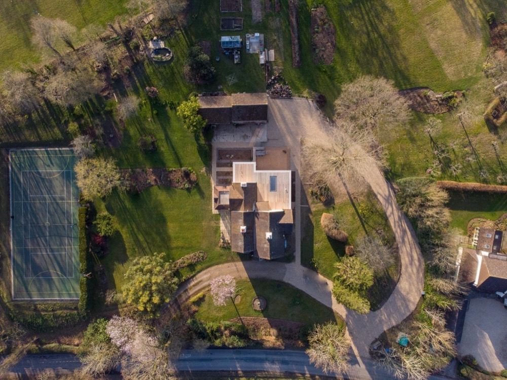 Craggwood, an aerial view of a house set within mature gardens