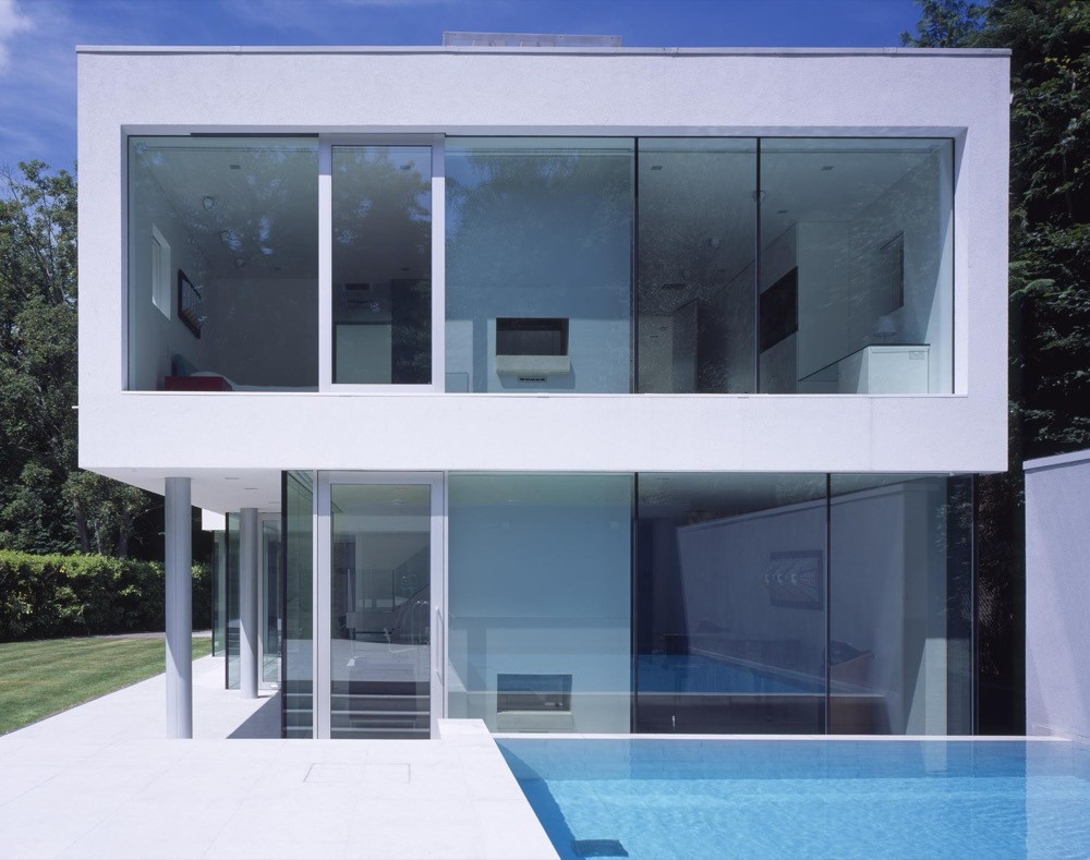 Esher House, a glazed pavilion opening onto a pool